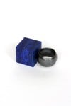 Blue cube on black ring by Making Dust
