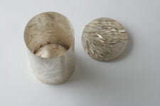 Gum leaves vessel & Grass brooch/lid by Marian Hosking